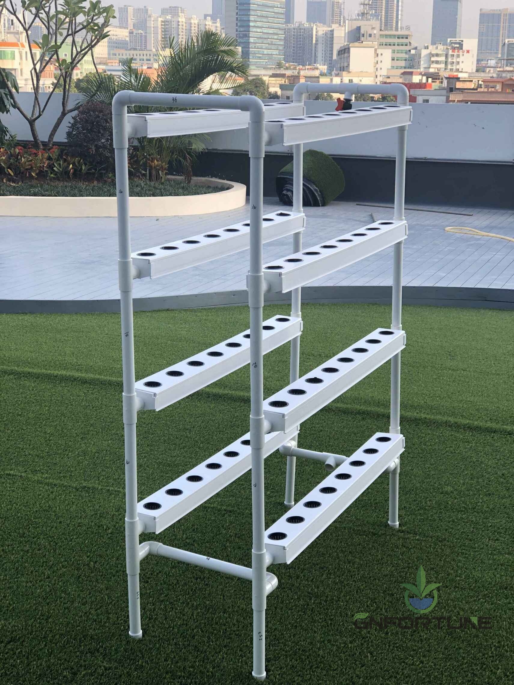 Four layer mini NFT home garden kit standing on a garden lawn