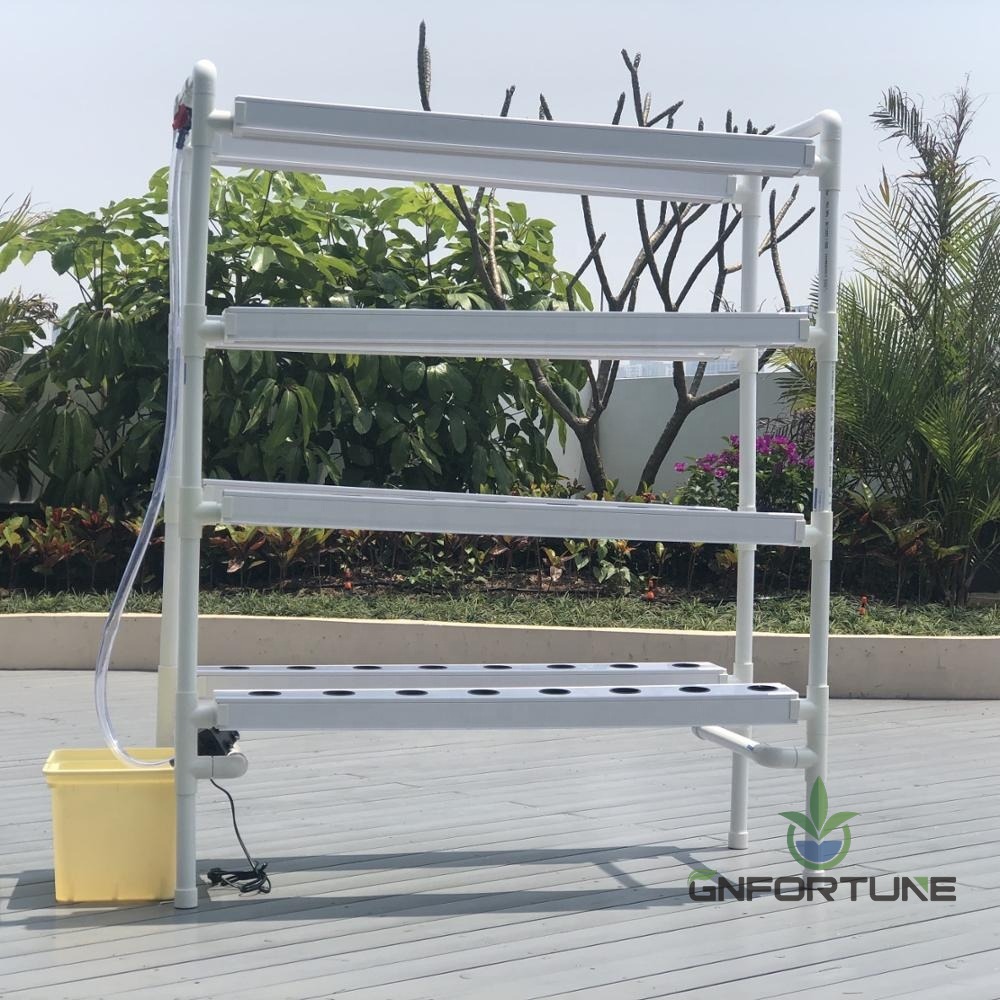 Mini NFT home garden kit installed on a rooftop with its reservoir tank